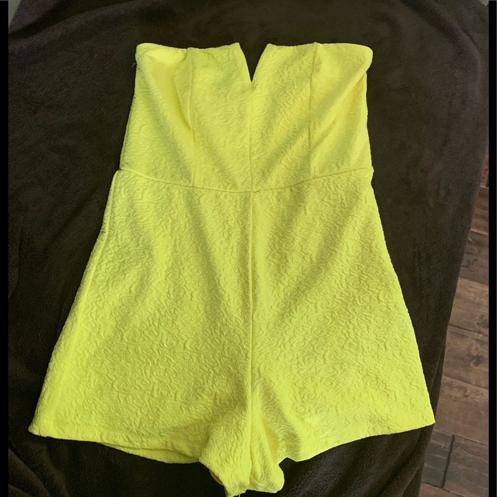 Yellow romper with floral design